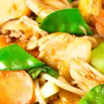 Close-up homemade Chinese chicken chop suey fakeaway served with egg fried rice.