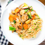 Overhead homemade Chinese chicken chop suey fakeaway served with egg fried rice.