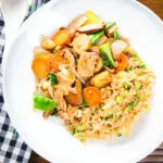 Overhead homemade Chinese chicken chop suey fakeaway served with egg fried rice.