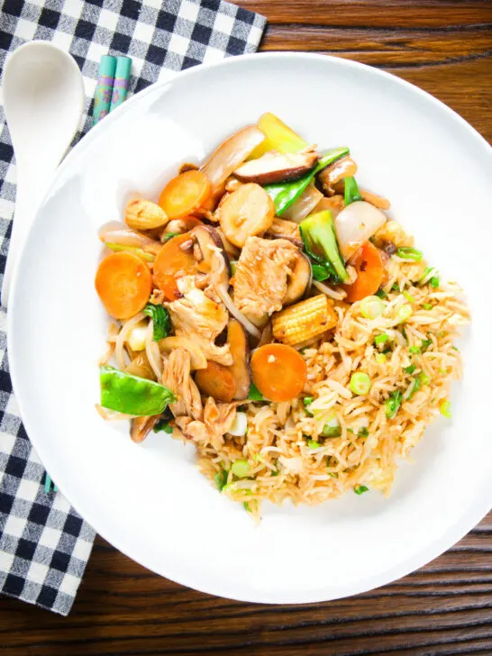 Overhead homemade Chinese chicken chop suey fakeaway served with egg fried rice.