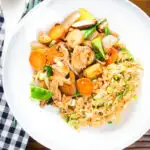 Overhead homemade Chinese chicken chop suey fakeaway served with egg fried rice.