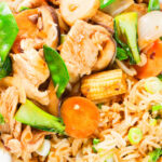 Overhead close-up homemade Chinese chicken chop suey fakeaway served with egg fried rice.