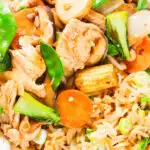 Overhead close-up homemade Chinese chicken chop suey fakeaway served with egg fried rice.