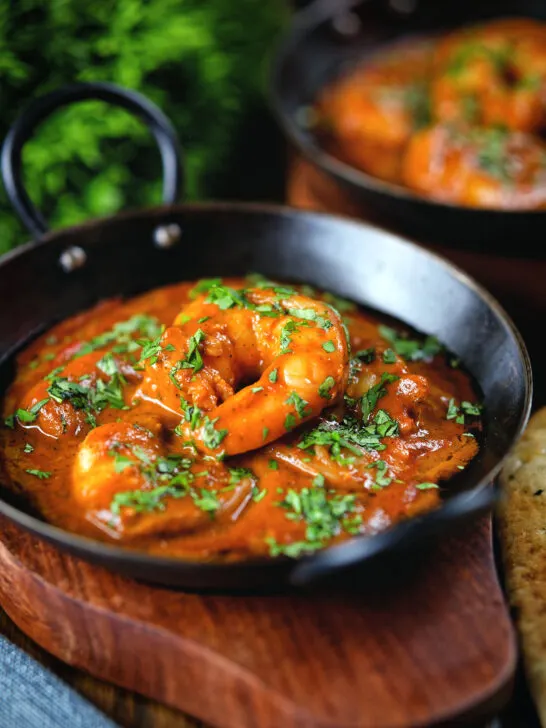 Indian takeaway inspired king prawn Balti curry with naan bread.