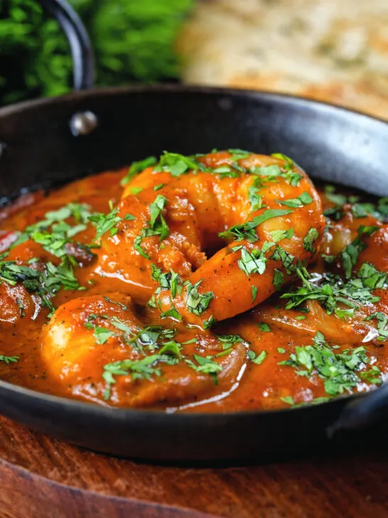 Close-up Indian takeaway inspired king prawn Balti curry.