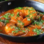 Close-up Indian takeaway inspired king prawn Balti curry.