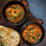 King prawn Balti curry fakeaway served with naan bread.