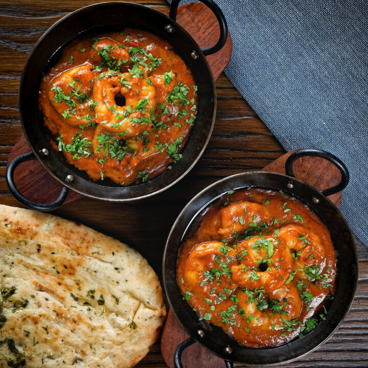 King prawn Balti curry fakeaway served with naan bread.