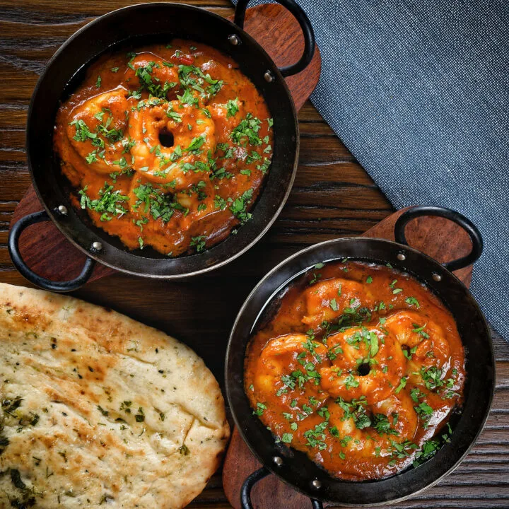 King prawn Balti curry fakeaway served with naan bread.