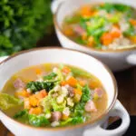 Traditional Scotch broth soup with lamb, pearl barley and savoy cabbage.