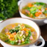 Traditional Scotch broth soup with lamb, pearl barley and savoy cabbage.
