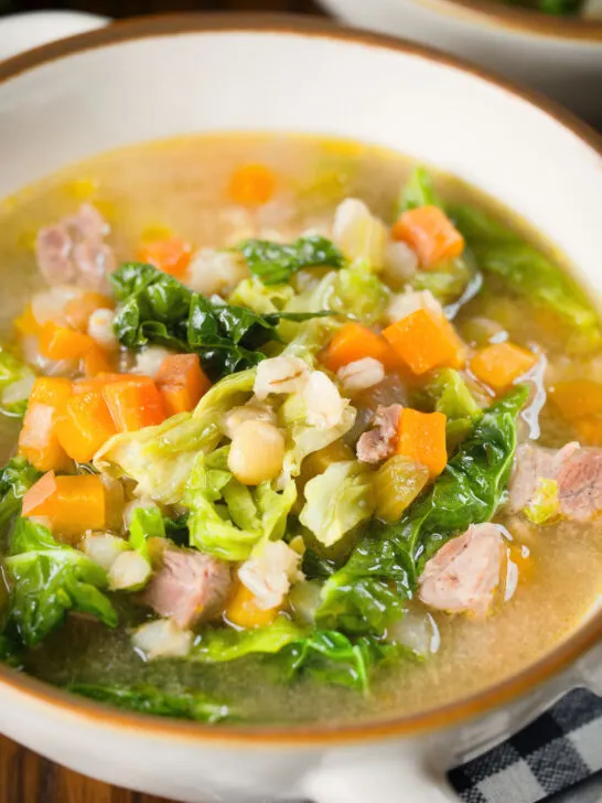 Close-up Scotch broth soup with lamb, pearl barley and savoy cabbage.