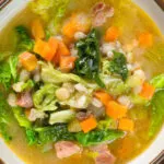 Overhead close-up Scotch broth soup with lamb, pearl barley and savoy cabbage.
