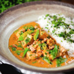 Satay chicken curry with peanuts and coriander served with steamed rice.