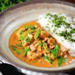 Satay chicken curry with peanuts and coriander served with steamed rice.