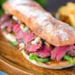 Steak, stilton and caramelised onion sandwich served on ciabatta with french fries.