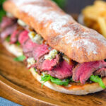 Steak, stilton and caramelised onion sandwich served on ciabatta with french fries.