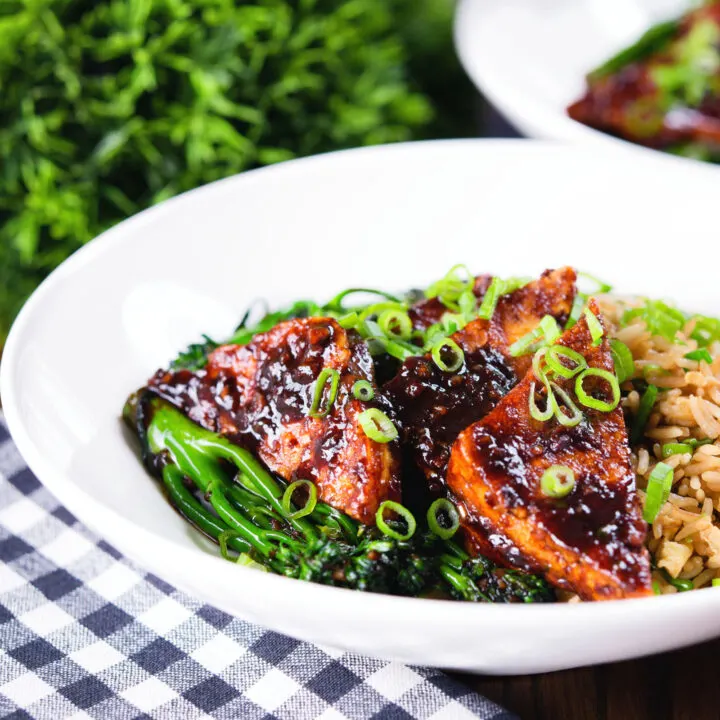 Fried tofu in black bean sauce with tenderstem broccoli and egg fried rice.