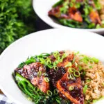 Spicy fried tofu with black bean sauce and tenderstem broccoli served with egg fried rice.