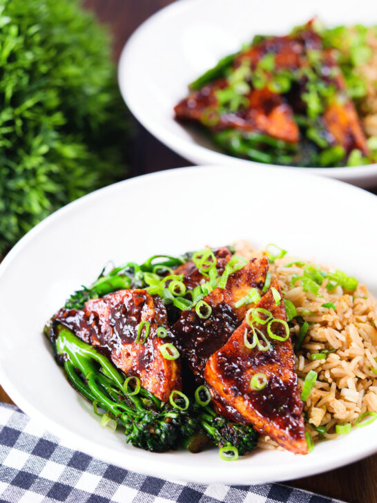 Spicy fried tofu with black bean sauce and tenderstem broccoli served with egg fried rice.