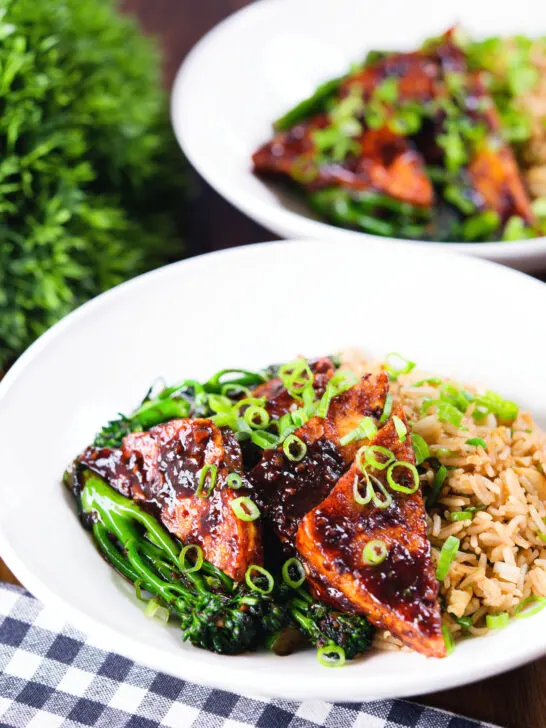 Spicy fried tofu with black bean sauce and tenderstem broccoli served with egg fried rice.