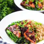 Spicy fried tofu with black bean sauce and tenderstem broccoli served with egg fried rice.