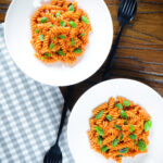 Overhead creamy tomato, basil and and mascarpone cheese pasta.