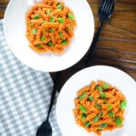 Overhead creamy tomato, basil and and mascarpone cheese pasta.