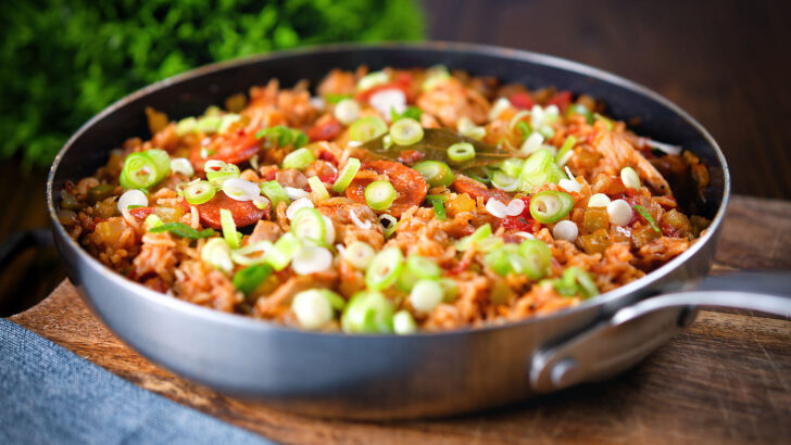 One-pot Cajun chicken and chorizo jambalaya with spring onions.