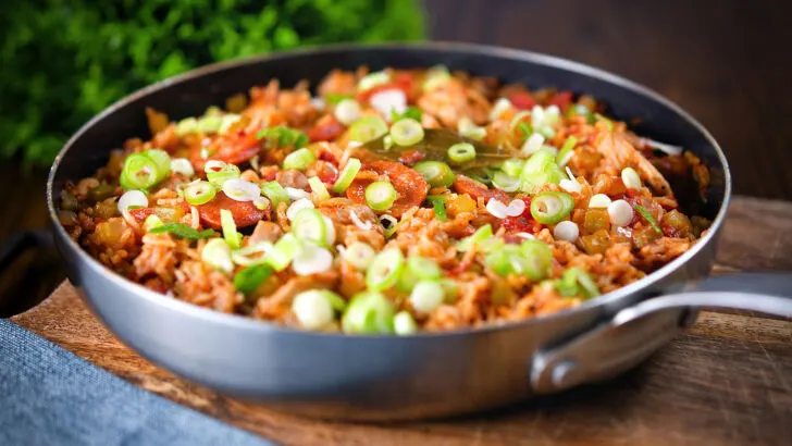 One-pot Cajun chicken and chorizo jambalaya with spring onions.