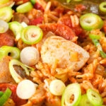 Close-up one-pot Cajun-influenced chicken and chorizo jambalaya.