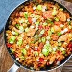 Overhead one-pot Cajun-influenced chicken and chorizo jambalaya.