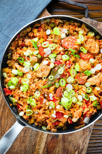 Overhead one-pot Cajun-influenced chicken and chorizo jambalaya.