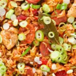 Overhead close-up one-pot Cajun-influenced chicken and chorizo jambalaya.
