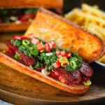 Argentinian-Influenced choripan sandwich with Spanish chorizo, chimichurri and salsa
