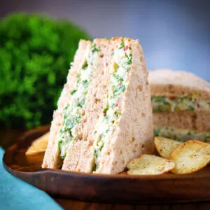 Canned crab sandwich with coriander, lime and chilli mayonnaise served with crisps.