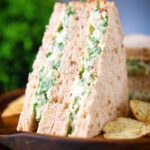 Canned crab sandwich with coriander, lime and chilli mayonnaise on seeded bread.