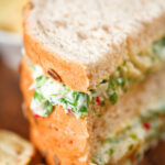 Tinned crab sandwiches with coriander, lime and chilli mayonnaise serve with crisps.