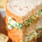 Tinned crab sandwiches with coriander, lime and chilli mayonnaise serve with crisps.