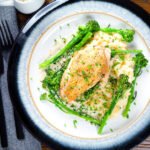 Overhead creamy tarragon chicken breasts served with celeriac mash and tenderstem broccoli.