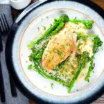 Overhead creamy tarragon chicken breasts served with celeriac mash and tenderstem broccoli.