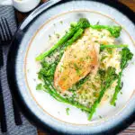 Overhead creamy tarragon chicken breasts served with celeriac mash and tenderstem broccoli.