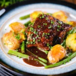 Spicy devilled chicken thighs served with roasted new potatoes, green beans and chives.