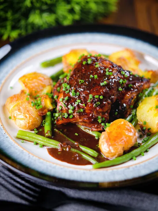 Spicy devilled chicken thighs served with roasted new potatoes, green beans and chives.