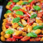 Gnocchi tray bake with sun-dried and fresh tomatoes, mozzarella and pickled chilli.