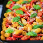 Gnocchi tray bake with sun-dried and fresh tomatoes, mozzarella and pickled chilli.