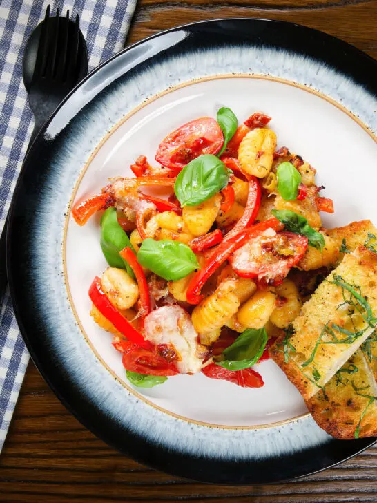 Gnocchi tray bake with sun-dried and fresh tomatoes, mozzarella and chilli served with garlic ciabatta.