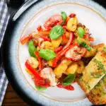 Gnocchi tray bake with sun-dried and fresh tomatoes, mozzarella and chilli served with garlic ciabatta.