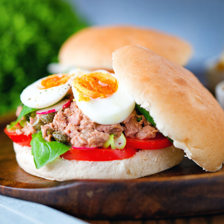 Pan bagnat (French tuna sandwich) with tomatoes, boiled egg and capers.