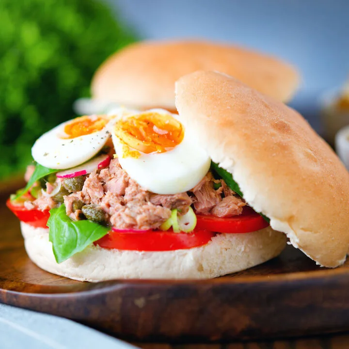 Pan bagnat (French tuna sandwich) with tomatoes, boiled egg and capers.